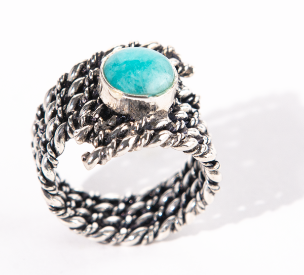 Handmade sterling silver ring with a woven band and amazonite stone.