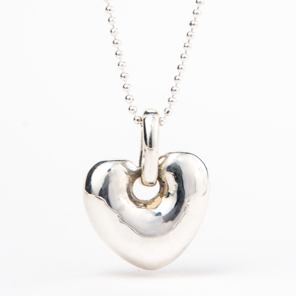 Smooth sterling silver heart pendant with a modern design