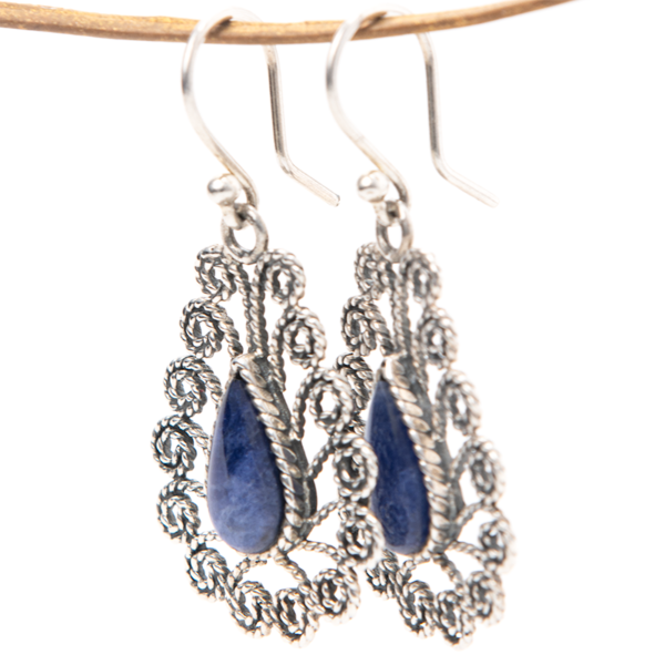 Intricately handcrafted sterling silver earrings featuring teardrop-shaped Sodalite stones