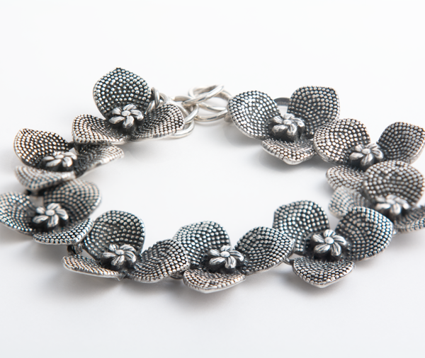 Handcrafted sterling silver orchid flower bracelet with intricate detailing