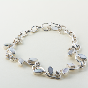 Handmade sterling silver bracelet with mother-of-pearl inlays and delicate leaf accents