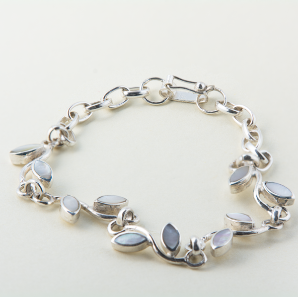 Handmade sterling silver bracelet with mother-of-pearl inlays and delicate leaf accents