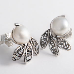 Handmade sterling silver earrings with pearls and intricate filigree details.