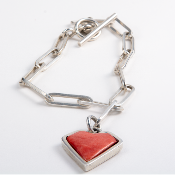 Sterling silver chain bracelet with a red spiny oyster heart charm