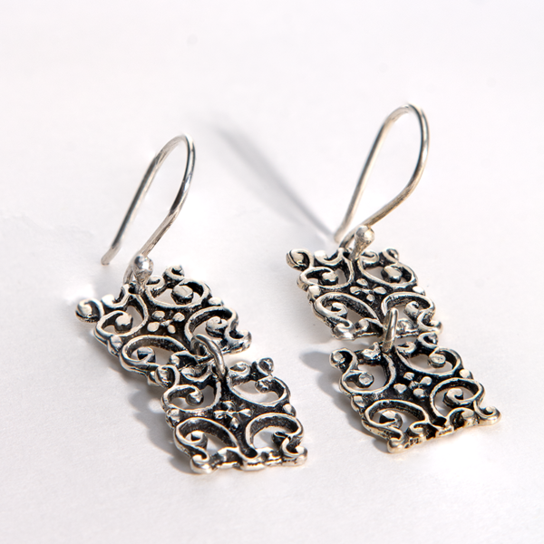 Handmade sterling silver filigree earrings with an intricate lace-like pattern