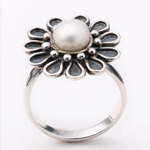 Handmade sterling silver daisy ring with natural pearl centerpiece.