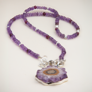 Peruvian Delight .950 sterling silver Amethyst Druzy Stalactite Statement Necklace with natural geode slice pendant on hand-strung amethyst and garnet beaded strand, front view