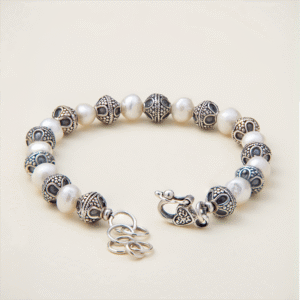 alternating freshwater pearls and hand-granulated orb beads with oxidised finish and heart-motif clasp